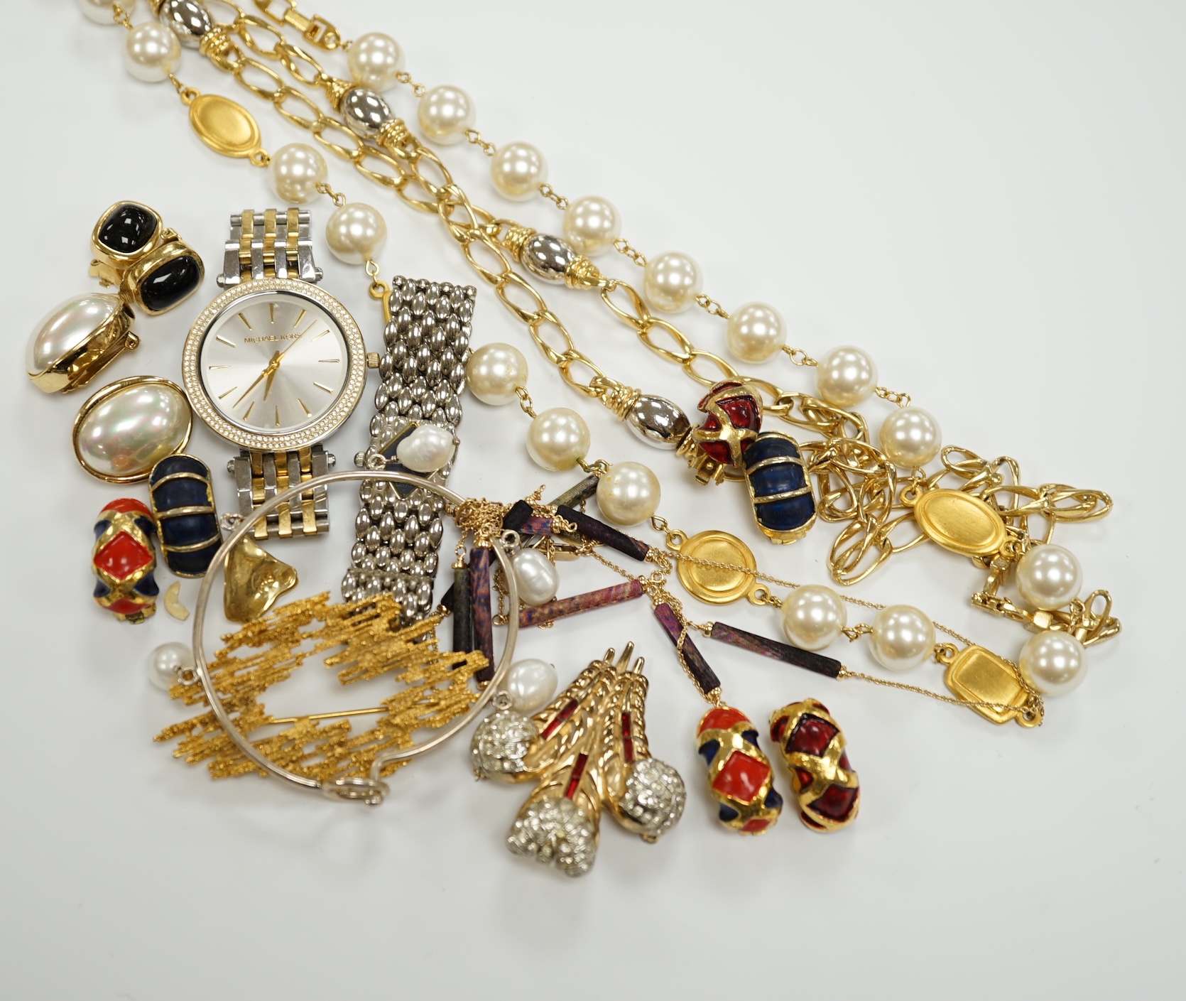Two Christian Dior necklaces and three pairs of Dior ear clips, together with other signed pieces of costume jewellery.